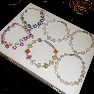 Sparkling colorful flower-shaped bracelets arranged on a luxury jewelry box