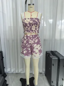 Detailed view of purple floral smocked camisole and matching lace-trim shorts set