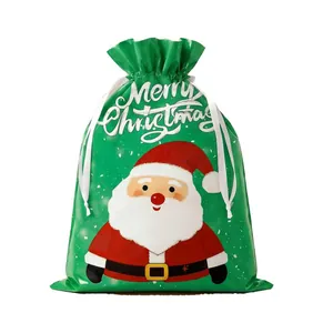 Green Christmas drawstring gift bag with Santa Claus cartoon and Merry Christmas text