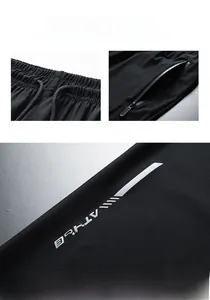 Details von elastischem Bund und Reißverschlusstasche an atmungsaktiver Hose