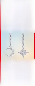 Detail of S925 silver moon and star earrings featuring shimmering moissanite stones