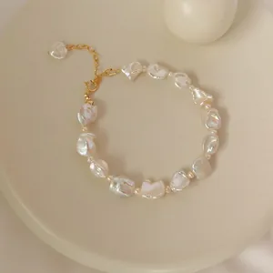 Detailed shot of baroque freshwater pearl bracelet with adjustable gold-toned chain