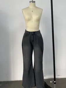 Detail of high waist wide leg denim jeans in charcoal grey with vintage washed texture