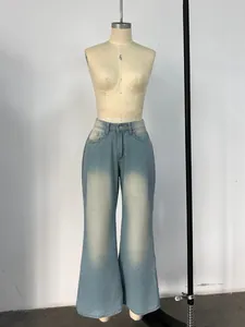 Detailed front view of light blue wide-leg jeans with high-waisted cut and washed finish