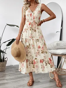 Robe longue d'été sans manches à fleurs avec col en V profond et ourlet à volants