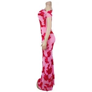Side view of pink mesh fishtail dress with detailed red floral embroidery appliques