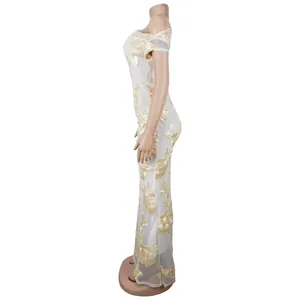 Close-up of elegant white mesh evening dress featuring intricate 3D floral embroidery details