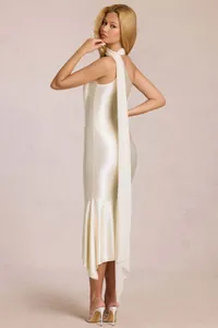 Detail of cream satin halter dress showing elegant waist draping and high-gloss texture