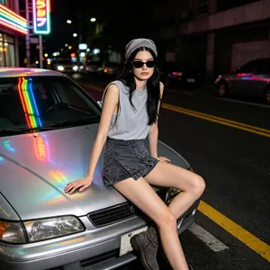 Detail of grey knitted tank top and distressed denim skirt on model in street scene