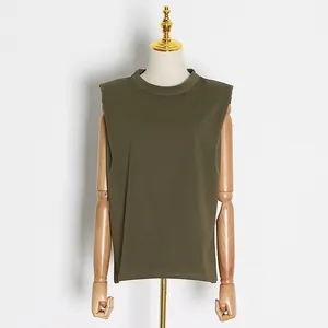 Detailed front view of olive green muscle tee with padded shoulders on a wooden mannequin