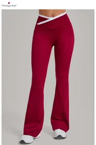Detail showing the retro red yoga flare pants with a white criss-cross high waistband