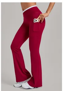 Detail of burgundy flare yoga leggings showing functional side pocket with a smartphone