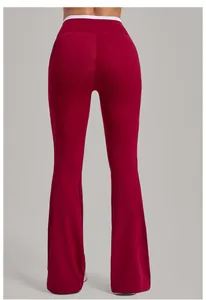 Rear view detail of dark red flared yoga pants with white waist trim and lifting seams