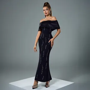 Elegant off-shoulder black evening gown with silver rhinestones and a slim fit design