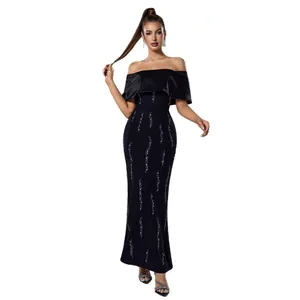 Elegant off-shoulder black evening gown with silver sequin waves and slim fit design