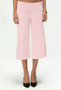 Detail of light pink knit culottes featuring a wide high-waist band and soft fluid fabric