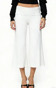 Detailed view of high-waist white wide-leg culottes with elegant draped fabric texture