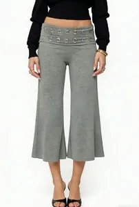 Detail of grey wide-leg culottes showing fabric texture and metal eyelet waist design