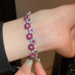 Exquisite flower charm bracelet with sparkling ruby-pink and clear stones in Korean style