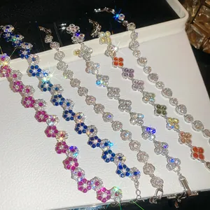 Detailed view of sparkling floral bracelets with multi-colored gemstones and shiny crystals