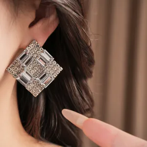 Elegant oversized rhinestone square earrings with a luxurious crystal geometric design.