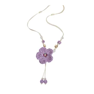 Sweet woven flower pendant necklace with purple beads and beige cord for vacation