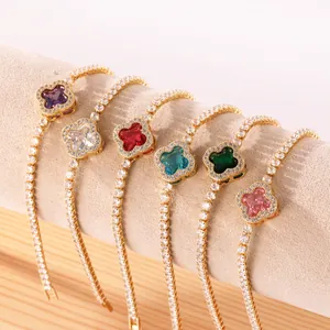 Detailed view of six colorful four-leaf clover charm tennis bracelets with gold plating