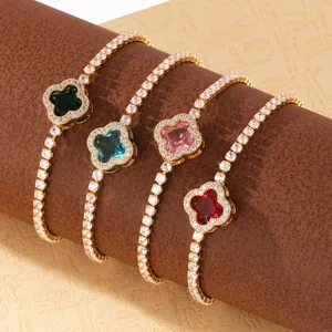 Detailed macro view of four-leaf clover bracelets featuring vibrant colorful gemstones