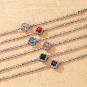 Detail view of colorful four-leaf clover tennis bracelets in various gemstone colors