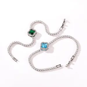 Sparkling silver-tone tennis bracelets featuring blue and green clover-shaped gemstones