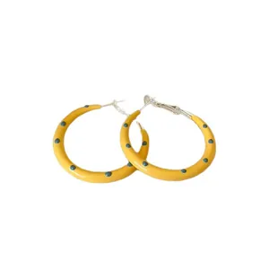 Fashionable yellow enamel hoop earrings with blue polka dots and silver needle posts