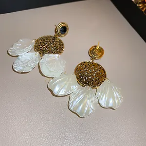 Bohemian retro shell drop earrings with golden hollow flower pattern and black crystal