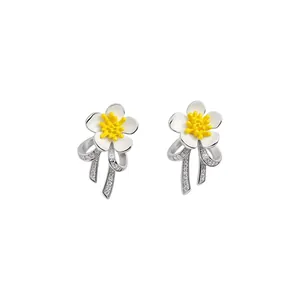 Exquisite flower and bow stud earrings with white enamel and sparkling zircon stones