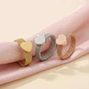 Minimalist stainless steel mesh rings with heart charms in gold, silver and rose gold