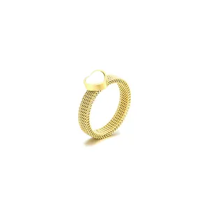 Minimalist gold mesh ring with white mother of pearl heart, elegant jewelry for women