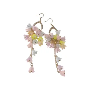 Elegant resin flower tassel earrings with rhinestone arches on plain white background.