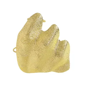 Detailed view of artistic irregular pleated gold joint ring with textured finish.