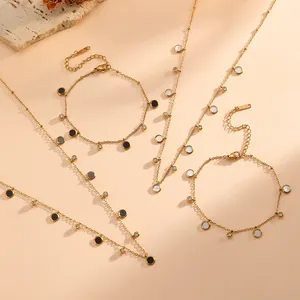 Detail view of French style gold-plated stainless steel necklaces and bracelets with charms
