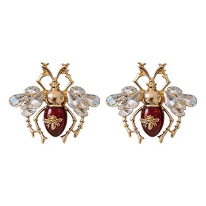 Elegant vintage insect bee stud earrings with crystal wings and red enamel body