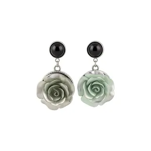 Elegant vintage resin rose dangle earrings with black round studs in ornate palace style