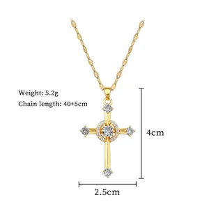 Detail of gold cross pendant with cubic zirconia, showing 4cm size and 5.2g weight