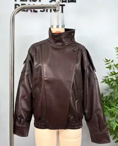 Detail of vintage brown faux leather jacket with high stand collar and shoulder straps