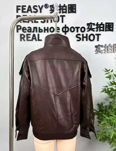 Detail of dark burgundy faux leather flight jacket with V-shape back stitching and ribbed hem
