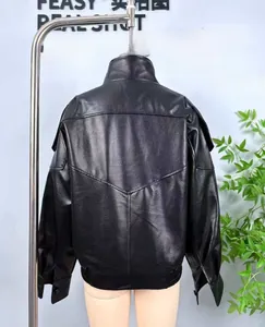 Back view of black faux leather bomber jacket with V-shaped stitching and ribbed hem