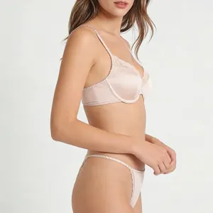 Elegant beige satin lingerie set with delicate lace trim and underwire support