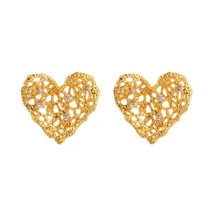 Elegant gold heart earrings with irregular hollow design and sparkling zircon accents