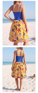 Detail view of starfish shell print on sundress with navy bodice and high waist