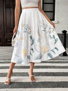 Detail of high-waisted A-line skirt with elegant lily print and white button closure