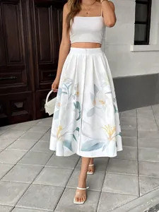 Detailed shot of white high-waist maxi skirt with blue floral print and button front