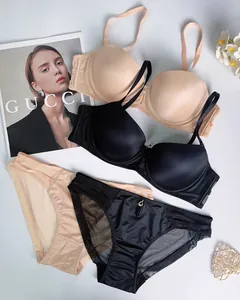 Seamless push-up bra and mesh panel panty set in beige and black colors with gold charm